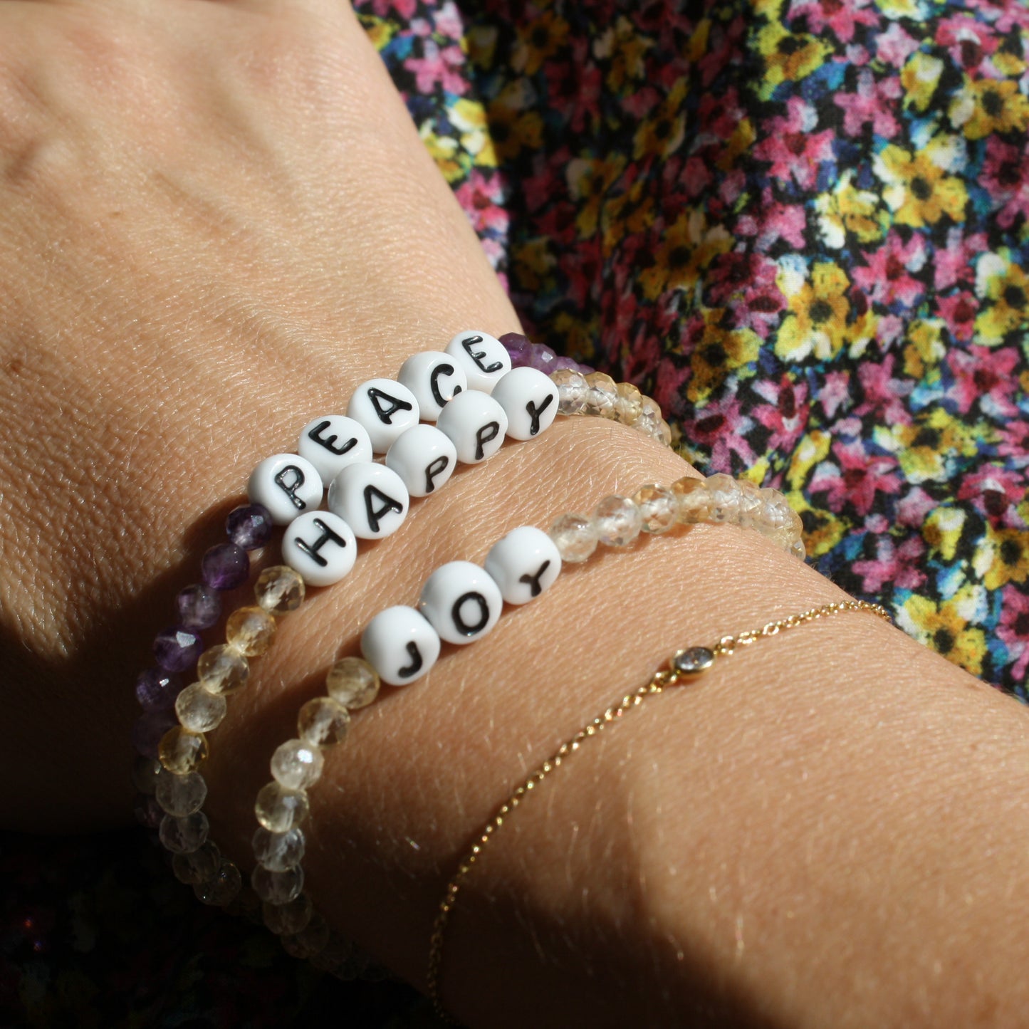 PEACE, HAPPY, and JOY bracelets in amethyst and citrine